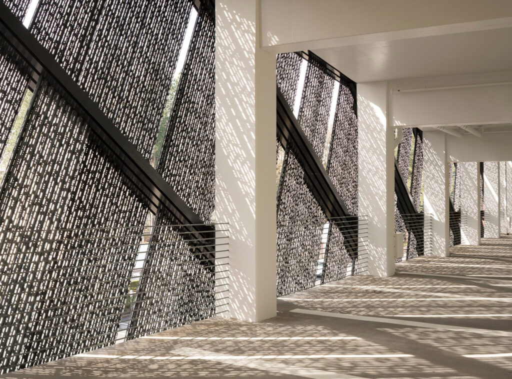 Shadows in a parking garage from perforated parking garage screen