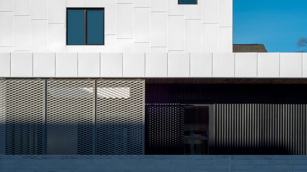 Expanded mesh shadow across residential facade
