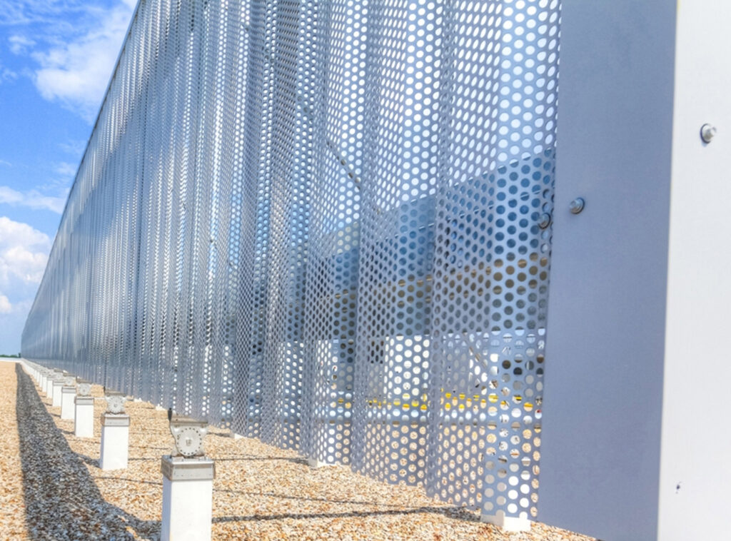 Corrugated perforated rooftop equipment screen, powder coated white