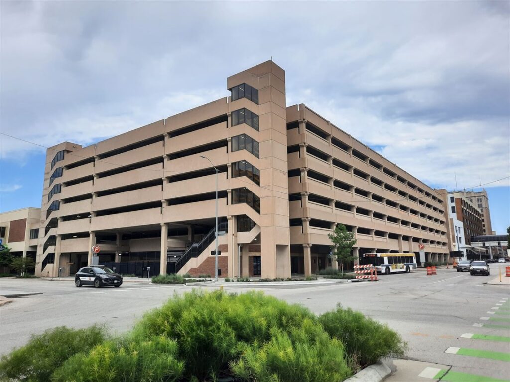 Before image of a Nano Banana test visualizing what an existing parking garage would look like with expanded mesh screens.